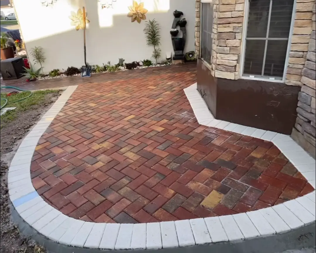 Brick paver entry walkway with a light soldier border