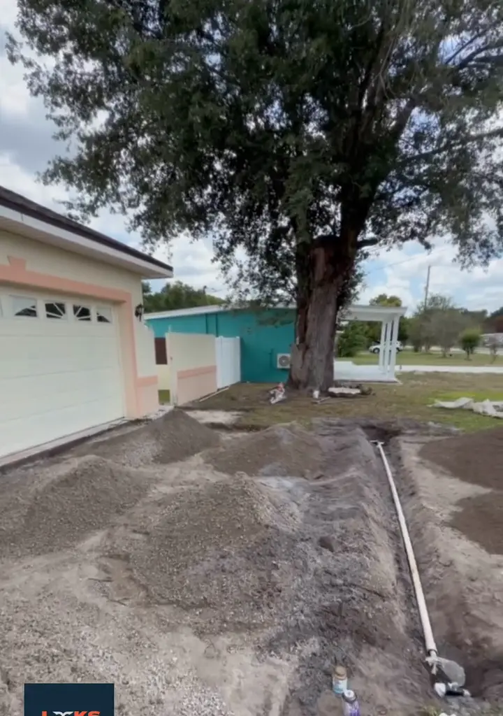 Driveway base excavated and prepared for pavers