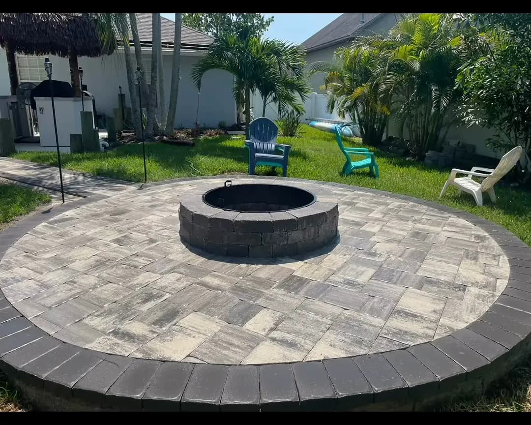 Round paver fire pit patio in a Central Florida backyard