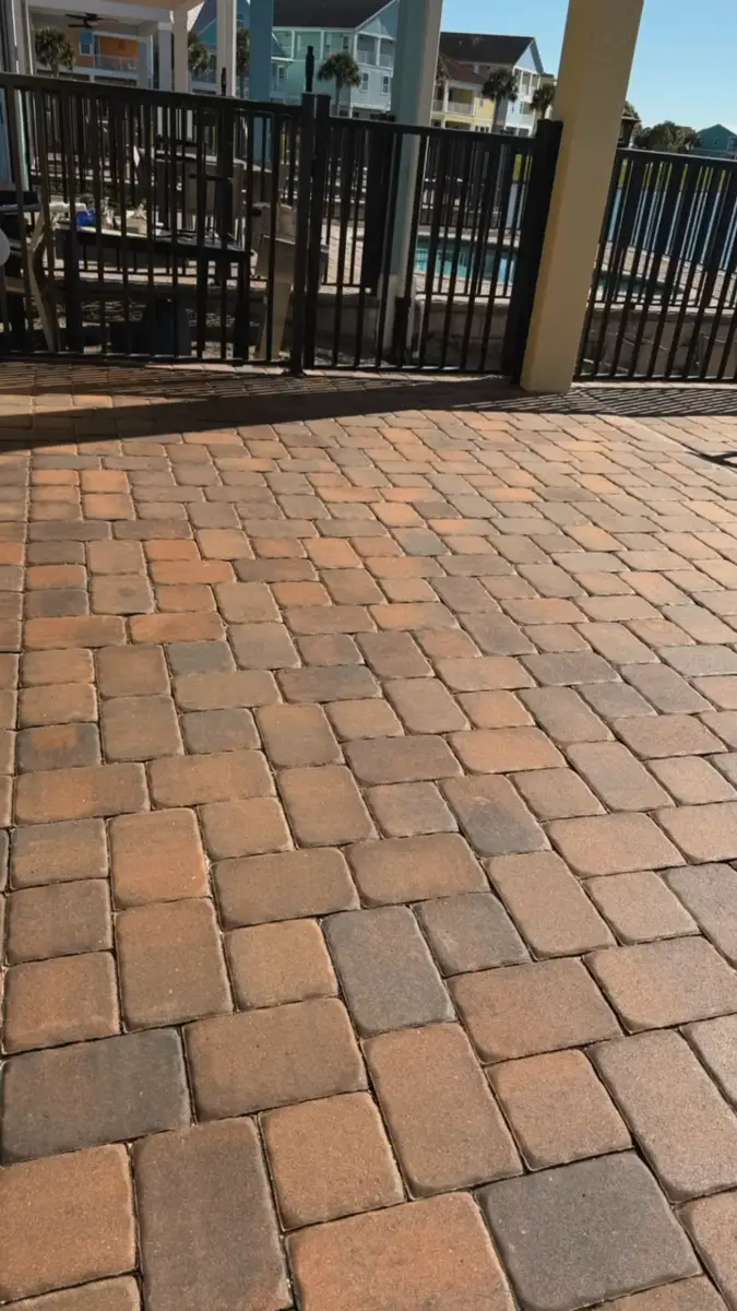 Sealed paver lanai next to a screened pool