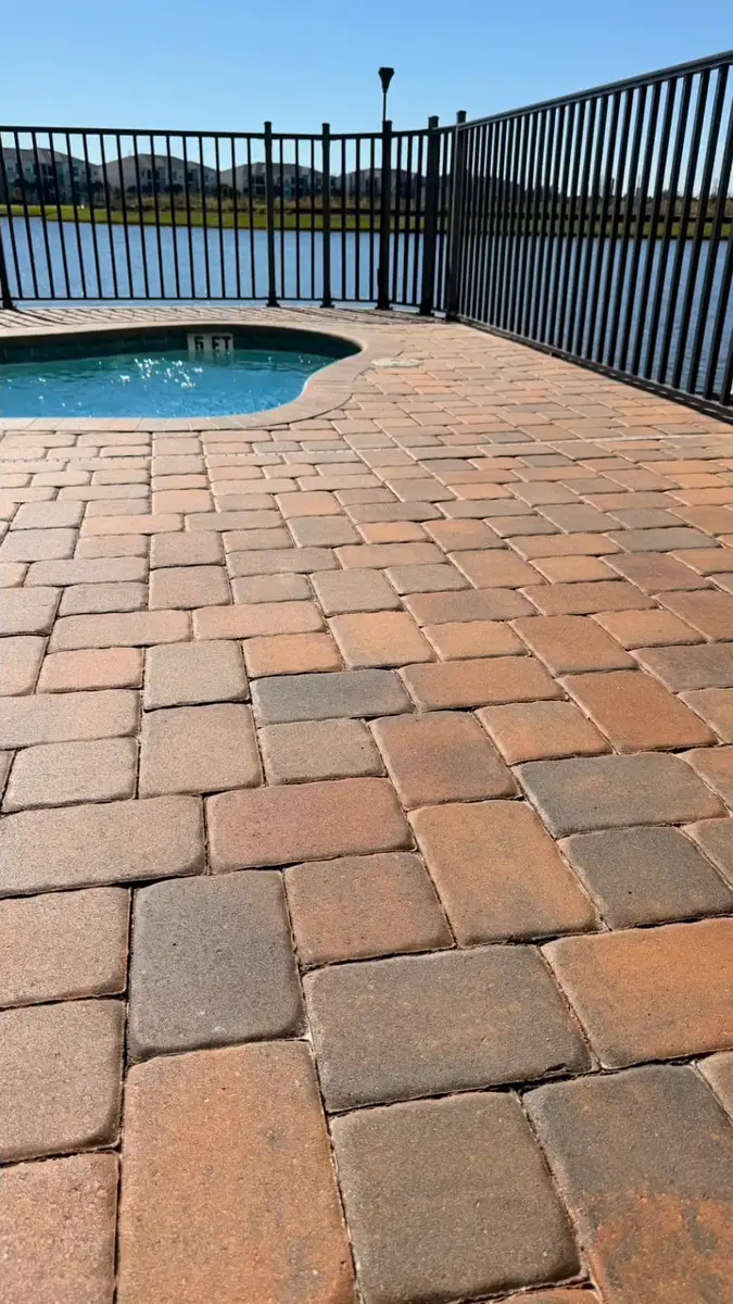 Paver pool deck on a lakefront home in Central Florida