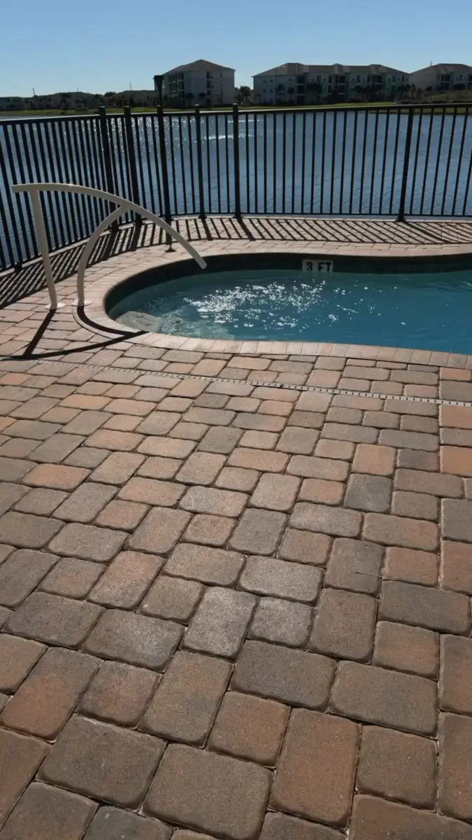 Paver pool deck restored after cleaning and sealing